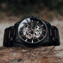Woodleigh, a stylish watch in maple and black, features an elegant design with visible mechanics.