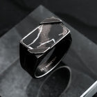 "Binomial Ring": a striking ring in marble and antique silver with a modern geometric design.