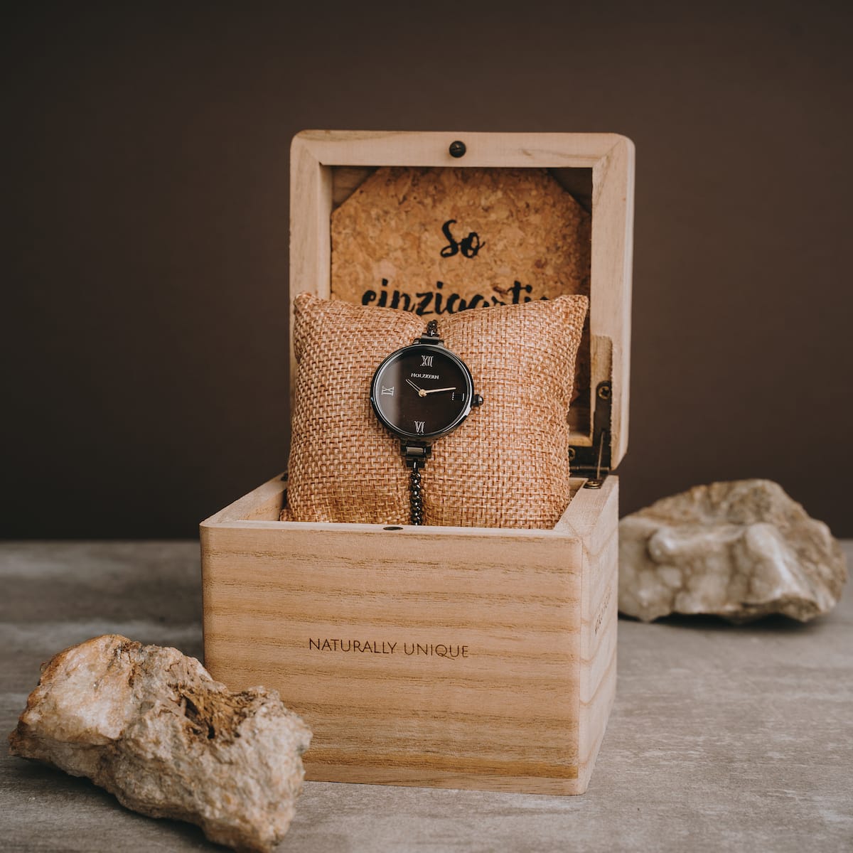 "Élisa" watch in nacre and dark grey, elegantly displayed in a wooden box.