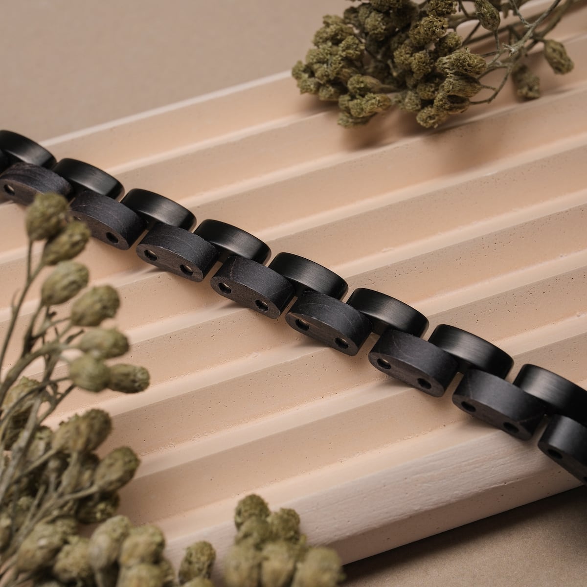 Duet bracelet features a maple and black design with a natural, minimalist style.