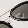 "The Enchanting" sunglasses featuring a Leadwood frame with antique silver accents for a stylish and elegant look.