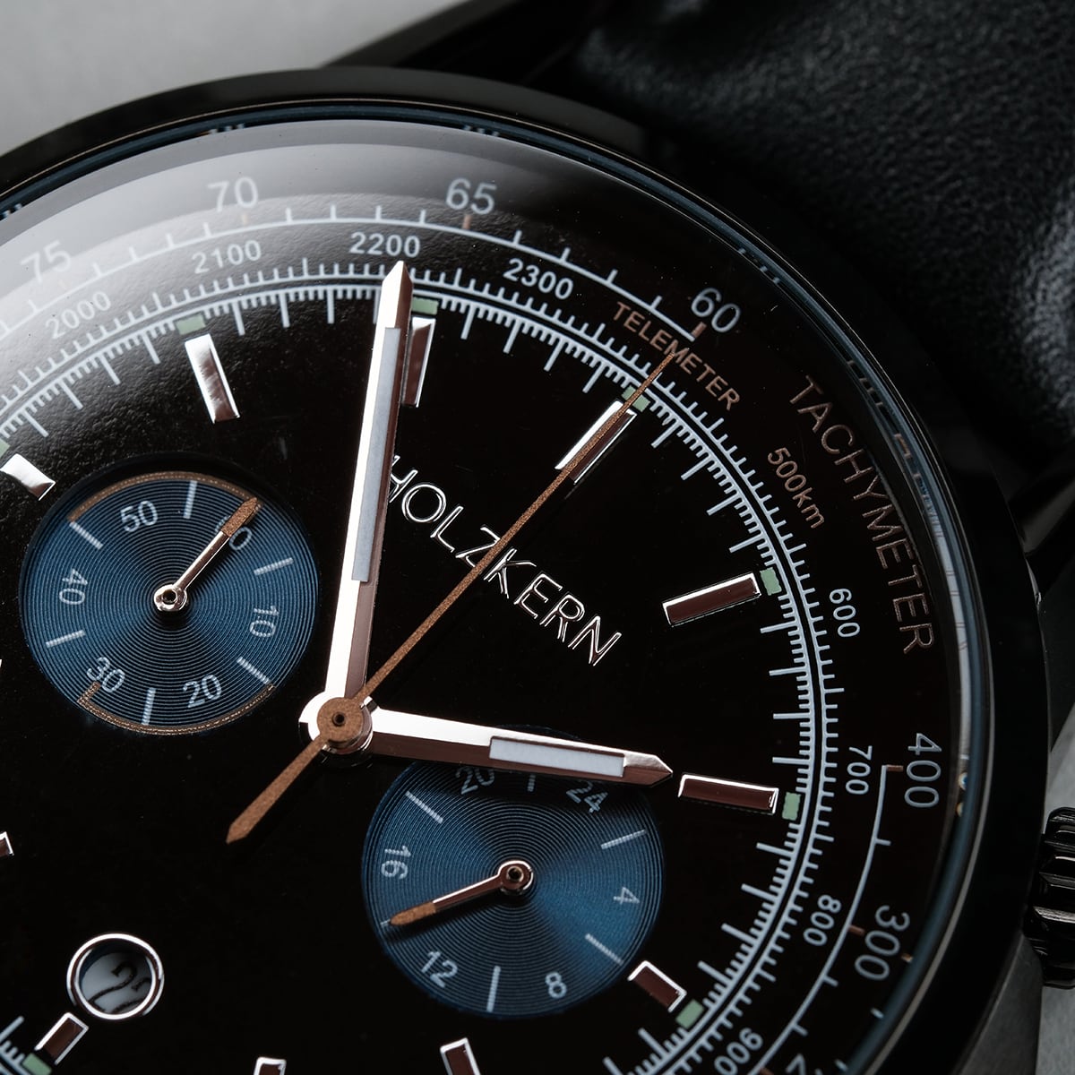 "Rackets, a sophisticated watch featuring a black dial and intricate detail."