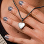 "Amorance Necklace", a heart-shaped nacre and silver necklace, exudes elegance and charm.