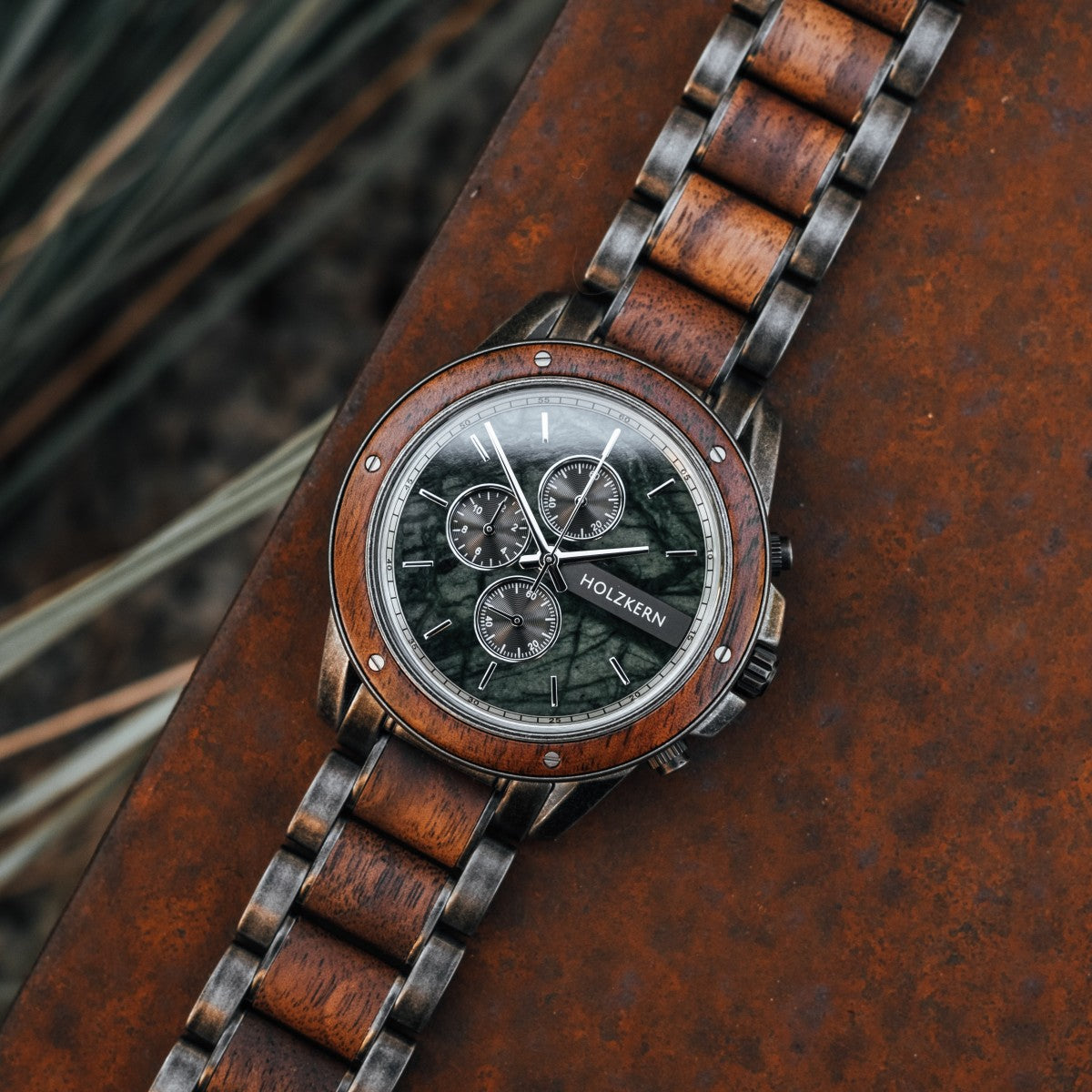 "Coel" watch featuring a walnut and marble design with a classic, rustic style.
