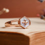 "Spectral Ring", a rose gold ring featuring a hexagonal nacre design with ornate detailing.