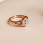 "Spectral Ring", a rose gold ring with a nacre hexagonal design and star motif, exuding elegance and style.