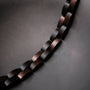 "Rondo" armband met een esdoorn en antieke koperen design in een moderne en elegante stijl.