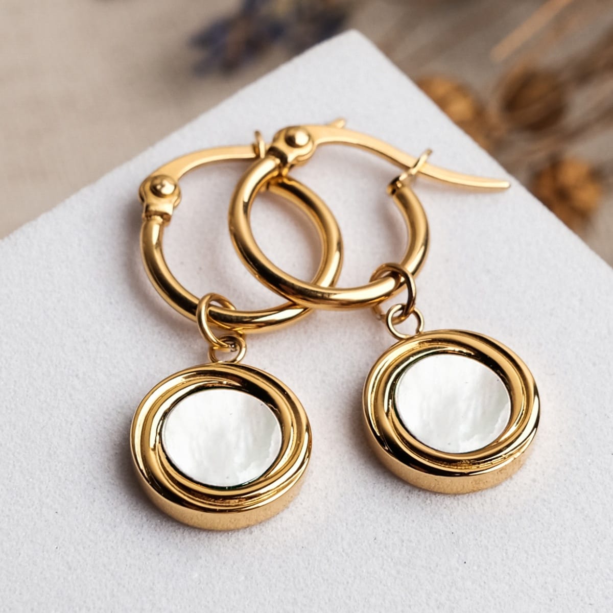 "Zendala Earrings" - Gold and white nacre earrings with a polished, elegant style.