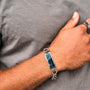 "Modulus Bracelet", a stylish bracelet featuring sodalite and silver elements, worn on a wrist.