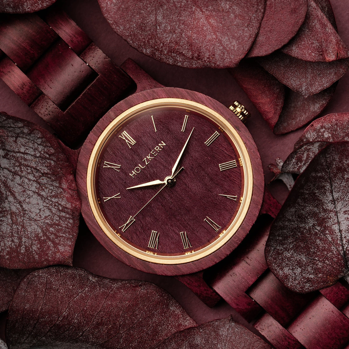 "Calm" watch in Amaranth, featuring an elegant design with wooden elements and a vibrant color scheme.