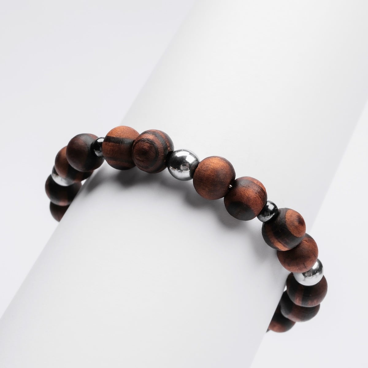 "Superset" bracelet features a stylish combination of hematite and walnut beads.