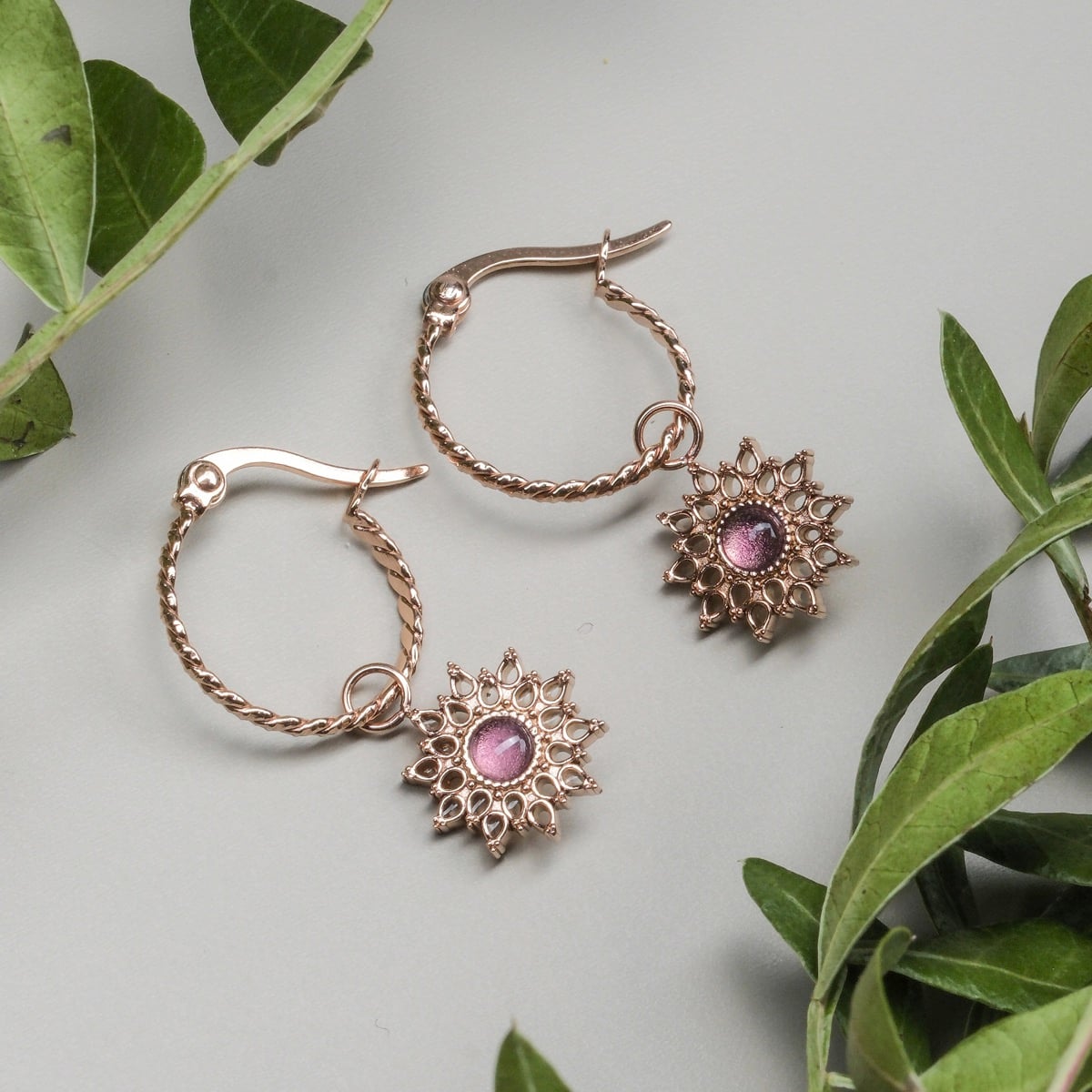 "Suncatcher Earrings" - elegant rose gold earrings with amethyst accents and intricate design.