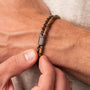 "Supersonic" bracelet featuring a zebrawood and gray design with chain link details.