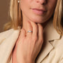 "Summersweet Ring" ring in nacre and rose gold, showcasing an elegant and modern style on a woman's hand.
