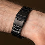 "Genevra, stylish watch with a black metal band and elegant detailing."
